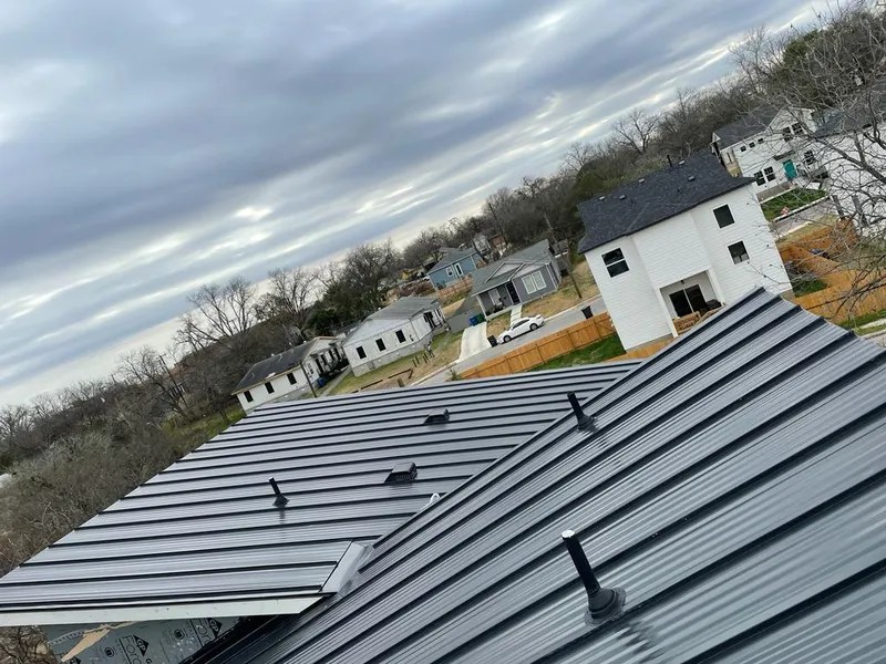 Standing seam metal roof panels with vents for Skylight Repair in Northfield